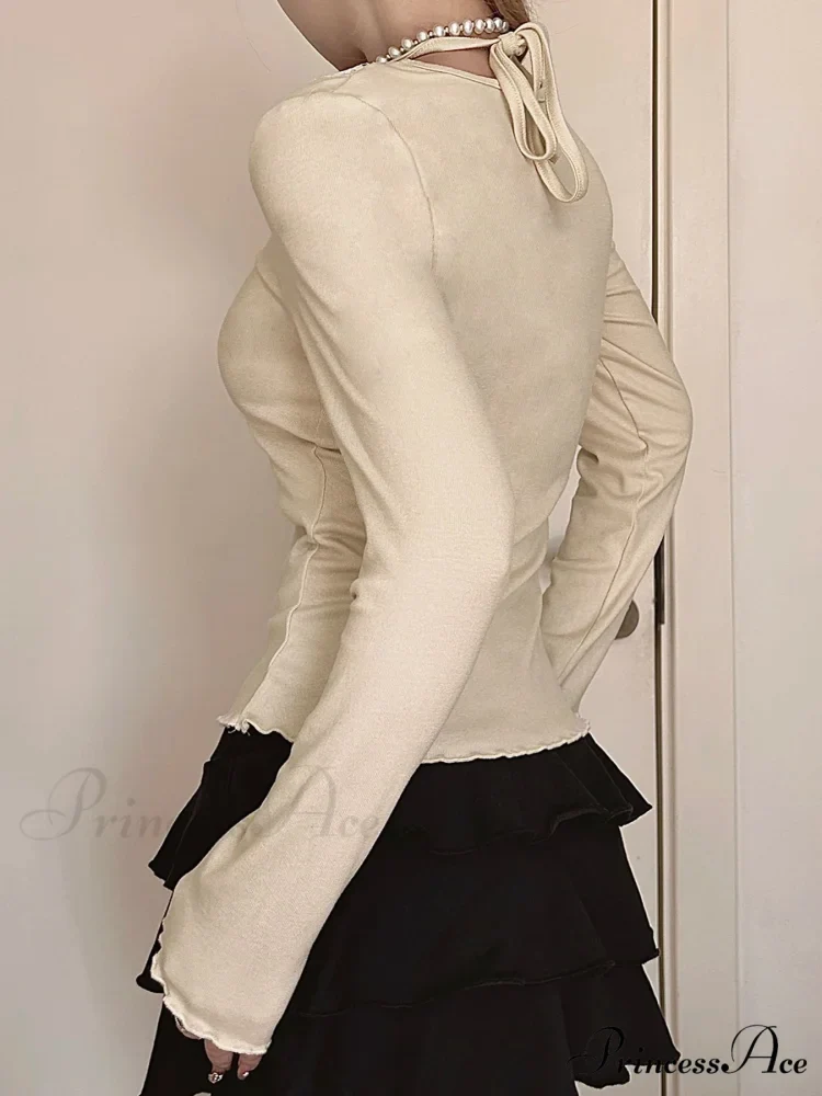 Bow Patchwork Lace Trim Halter V-Neck Long Sleeve Knit Top

Modified Title: Ribbon Patchwork Lace Trim Halter V-Neck Long Sleeve Knit Top - Image 2