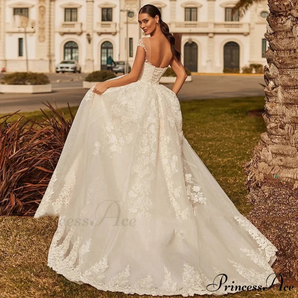 Creamy Ethereal Extended Train Wedding Gown - Image 2