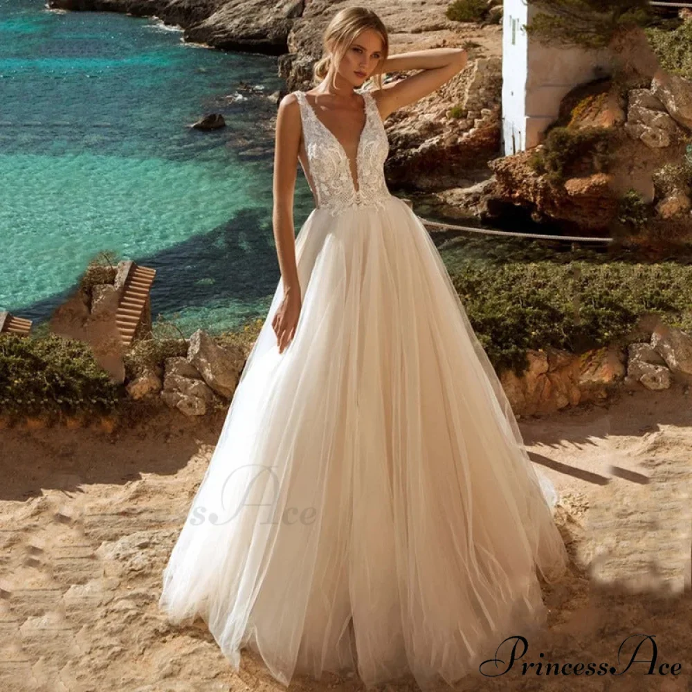 Low Plunging Backless Transparent Bridal Gown - Image 2