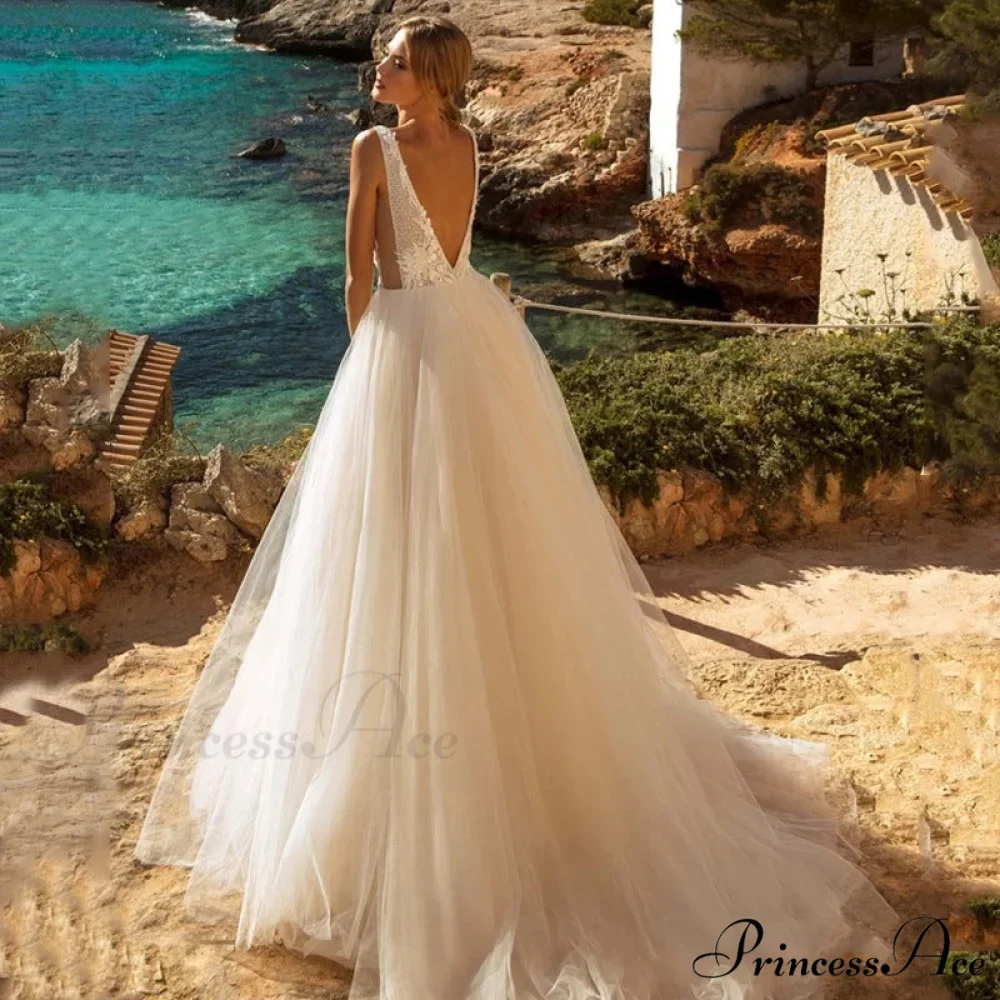 Low Plunging Backless Transparent Bridal Gown - Image 3