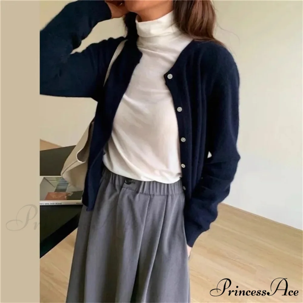 Single Breasted Solid Round Neck Knitted Cardigan

Modified Title: One Buttoned Plain Circular Neck Knitted Cardigan - Image 15