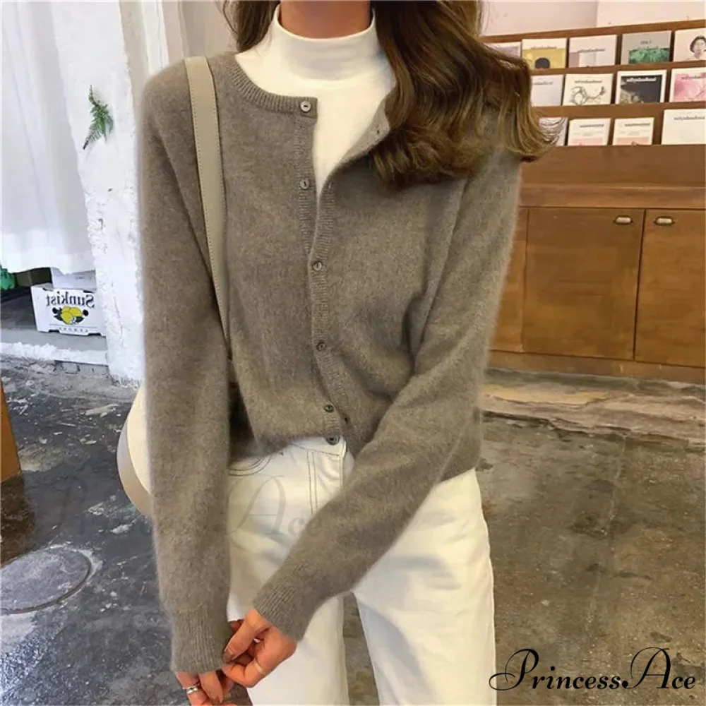 Single Breasted Solid Round Neck Knitted Cardigan

Modified Title: One Buttoned Plain Circular Neck Knitted Cardigan - Image 2