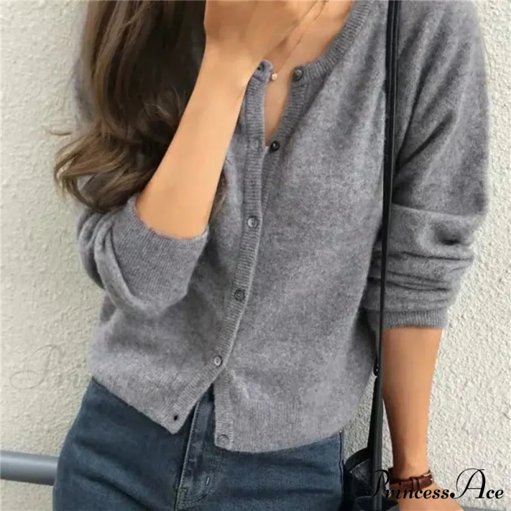 Single Breasted Solid Round Neck Knitted Cardigan

Modified Title: One Buttoned Plain Circular Neck Knitted Cardigan - Image 9