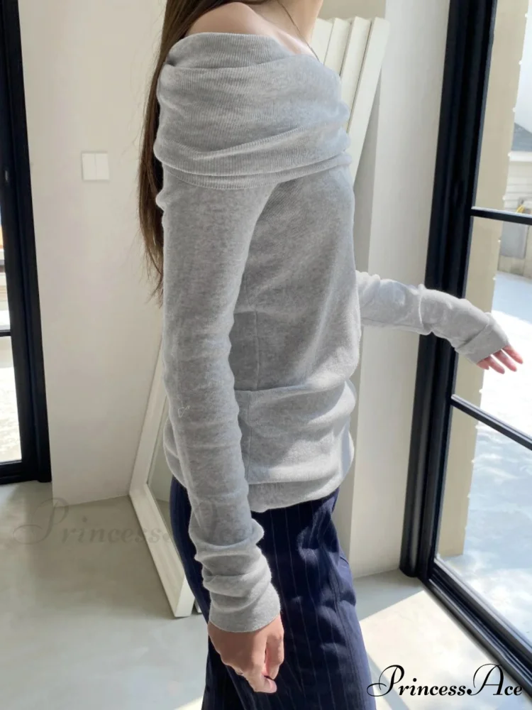 Slender Off-Shoulder Monochrome Slash Neck Extended Sleeve Knit Top - Image 2